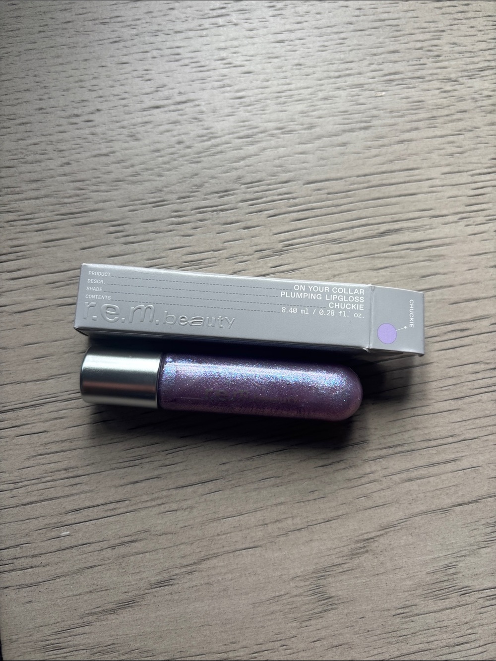 REM Beauty On Your Collar Plumping Lipgloss — Lavender Shimmer Chuckie